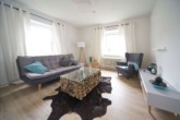 Musterwohnung Wohnzimmer - Schöne 3-Zimmerwohnung mit Dusche und EBK!