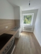 Küche - Frisch renovierte 2-Zimmer-Wohnung mit moderner Einbauküche