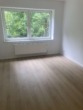 Wohnzimmer - Tolle 2,5-Zimmerwohnung in Altengroden!