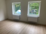Wohnzimmer - Schicke, sanierte 3-Zimmerwohnung in Altengroden!